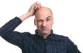 Confused bald guy scratch his head Royalty Free Stock Photo