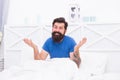 Confused bearded guy has some health problems with morning erection, mens healthy life Royalty Free Stock Photo