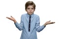 Confused boy giving I dont know gesture on white background. Royalty Free Stock Photo