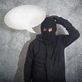 Confused burglar with speech balloon