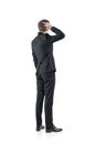 Confused businessman, rear view, isolated Royalty Free Stock Photo