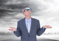 Confused businessman with sticky note stuck on his forehead against stormy sky in background Royalty Free Stock Photo