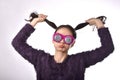 Confused and dizzy asian woman wear funny glasses, Girl`s hand pulling hair with face expression feeling worry.