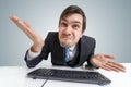 Confused frustrated and unsure man is working with computer Royalty Free Stock Photo