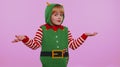 Confused girl in Christmas costume feeling embarrassed about ambiguous question having doubt no idea Royalty Free Stock Photo