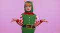 Confused girl in Christmas costume feeling embarrassed about ambiguous question having doubt no idea Royalty Free Stock Photo