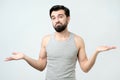 Hispanic showing I have no idea gesture, shrugging shoulders and raising hands Royalty Free Stock Photo