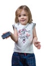 Confused little girl with a phone in hand