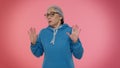 Confused mature old granny grandmother feeling embarrassed about question, having doubts, no idea Royalty Free Stock Photo