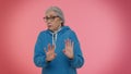 Confused mature old granny grandmother feeling embarrassed about question, having doubts, no idea Royalty Free Stock Photo