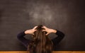 Confused pupil looking at chalkboard Royalty Free Stock Photo