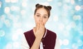 Confused teenage girl covering her mouth by hand Royalty Free Stock Photo