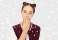 Confused teenage girl covering her mouth by hand Royalty Free Stock Photo
