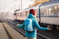 Confused tourist standing at wrong railway station platform