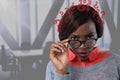 Confused woman holding her glasses with question marks in an office Royalty Free Stock Photo