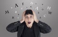 Confused woman with letters around her head Royalty Free Stock Photo