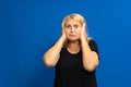 Confused woman puts her hands on the head. Portrait of woman sad girl closing her ears, hear nothing, deafness concept. Royalty Free Stock Photo