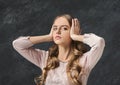 Confused woman puts her hands on the head. Royalty Free Stock Photo