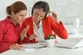 Confused women architects working in modern office Royalty Free Stock Photo
