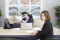 Confused woman in suit feeling stress on interview in the office