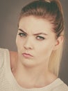 Confused young blonde woman looking suspicious Royalty Free Stock Photo