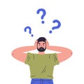 Confused young guy with question marks Royalty Free Stock Photo