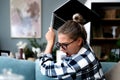 Confused young woman looking on laptop at home feeling bewildered by no connection, reading online news in internet, annoyed teen