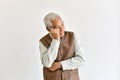 Confusing and forgetful elderly asian man with thinking gesture, Alzheimer`s disease Royalty Free Stock Photo