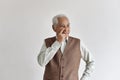 Confusing and forgetful elderly asian man with thinking gesture, Alzheimer`s disease. Royalty Free Stock Photo