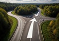 Confusing road junction with large arrows showing multiple directions ahead Royalty Free Stock Photo