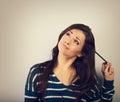 Confusion grimacing brunette woman thinking and looking up with Royalty Free Stock Photo