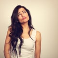 Confusion grimacing serious brunette woman thinking and looking Royalty Free Stock Photo