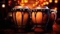 Conga drums on stage lit by warm stage lights with bokeh effect. Ideal for music themed projects and performance