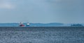 Congested traffic in the strait of Trangsund fairway from Vyborg port to Gulf of Finland with Vyborg castle and cityscape on