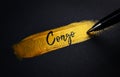 Congo Handwriting Text on Golden Paint Brush Stroke