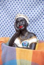 Namoradeira is a woman doll looking at the street through the window. Brazilian handicrafts made in adobe and traditional colonial