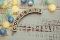 Congrats alphabet letter and LED cotton balls on wooden background