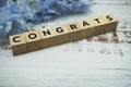 Congrats alphabet letter with space copy on wooden background