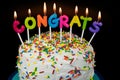 Congrats candles on layered cake Royalty Free Stock Photo