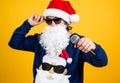 Congratulating his nearest. christmas songs. xmas shopping time. prepare gifts and presents. karaoke. happy bearded man Royalty Free Stock Photo