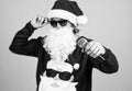 Congratulating his nearest. christmas songs. xmas shopping time. prepare gifts and presents. karaoke. happy bearded man Royalty Free Stock Photo