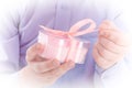 Congratulation! Boy open a gift in a pink box Royalty Free Stock Photo