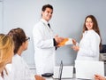 Congratulation of a female young doctor Royalty Free Stock Photo