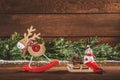 Congratulation Merry Christmas and Happy New Year. wooden christmas decorations and fir branches Royalty Free Stock Photo