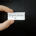 Congratulation note, handwritten tiny mesage, handwriting paper note. Royalty Free Stock Photo