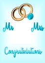 Congratulations with blue letters on a blue background , a pair of wedding rings