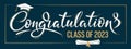 Congratulations Class of 2023 greeting sign on dark background. Academic cap and diploma. Congratulating banner. Handwritten brush