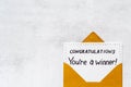 Congratulations award concept -You are a winner card in golden envelope