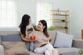 Congratulations. Loving asian mature daughter surprised mother with present in Mother& x27;s Day, giving her handmade Royalty Free Stock Photo