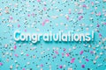 Congratulations text on pastel blue background with confetti Royalty Free Stock Photo